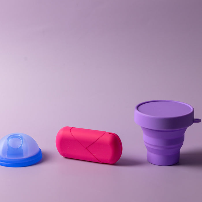     Bohokiwi blue menstrual disc, pink carrier case and purple collapsible steriliser