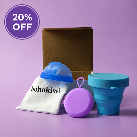 blue menstrual disc with storage bag blue steriliser and purple carrier case