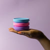     Bohokiwi collapsible menstrual cup sterilisers stacked in blue, purple and pink