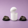 Two Bohokiwi Midnight Black menstrual discs beside an open White steriliser pod