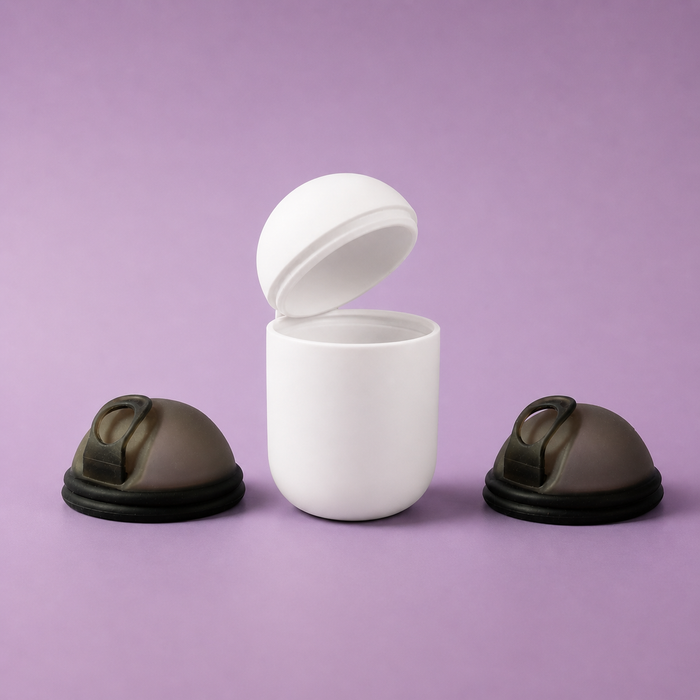 Two Bohokiwi Midnight Black menstrual discs beside an open White steriliser pod