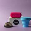 Bohokiwi Midnight Black menstrual disc with Pink capsule carrier case and Sky Blue collapsible steriliser