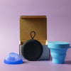 Bohokiwi Ocean Blue menstrual disc with Black round carrier case and Sky Blue collapsible steriliser