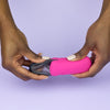  Bohokiwi Pink capsule style carrier case with Midnight Black menstrual disc being placed inside