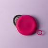 Bohokiwi Pink round menstrual disc carrier case with Midnight Black menstrual disc inside