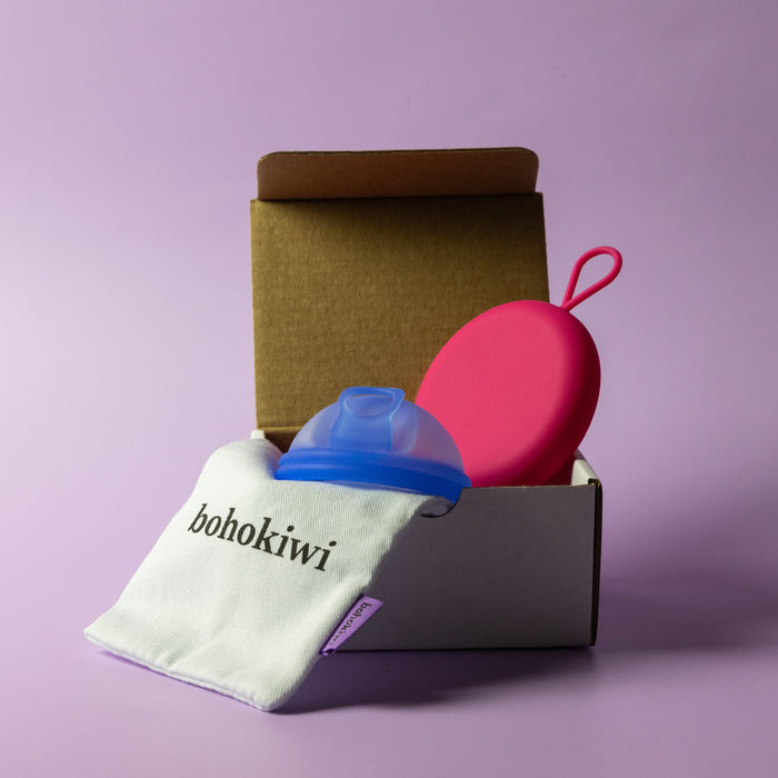 Bohokiwi Pink and Ocean Blue round menstrual disc carrier cases with cotton storage bag and box