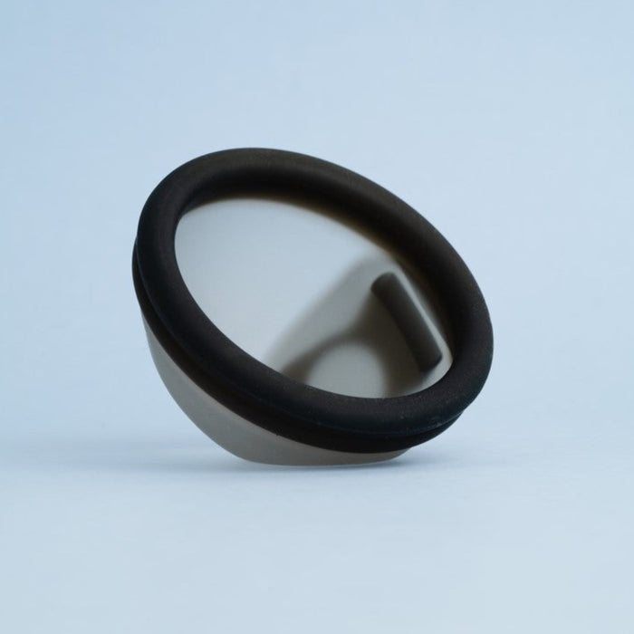 Bohokiwi Midnight Black menstrual disc angled to show the rim, basin and removal ring