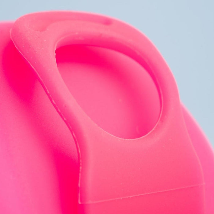  Close-up of Bohokiwi Neon Pink menstrual disc showing the rim and basin