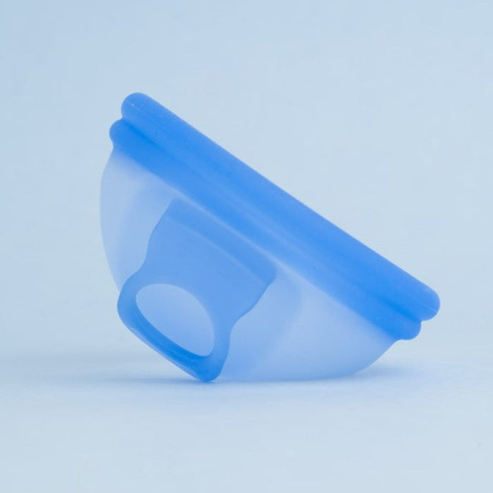 Bohokiwi Ocean Blue menstrual disc shown from the side with removal ring